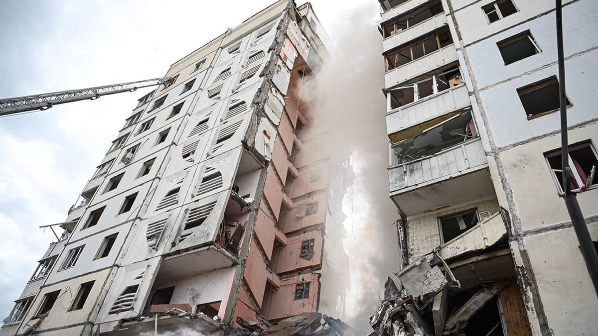 Apartment building partially collapses in a Russian border city after shelling; at least 13 killed