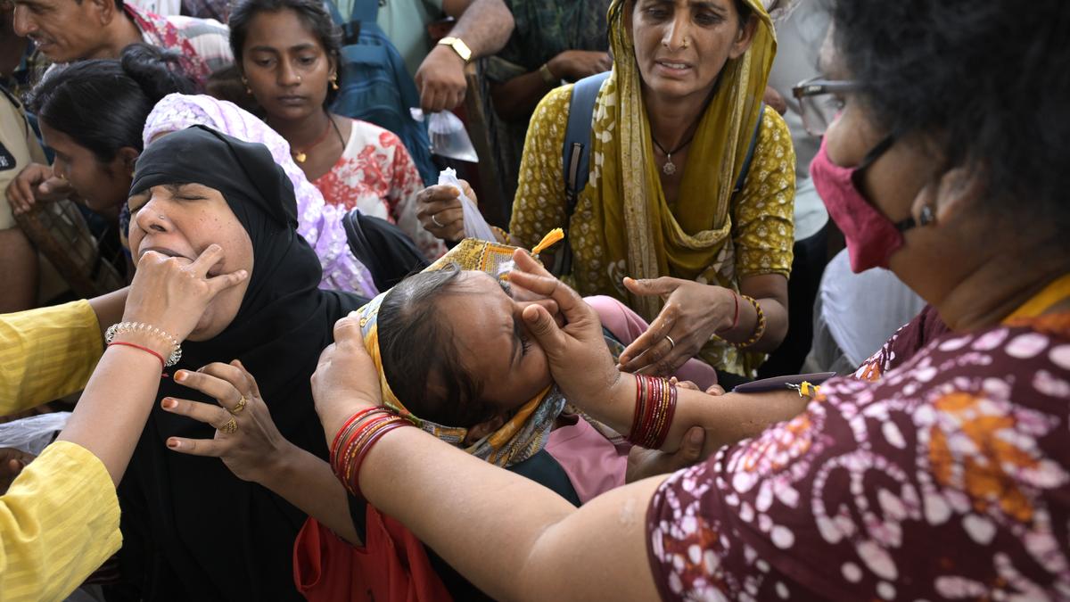 Thousands gather for fish prasadam