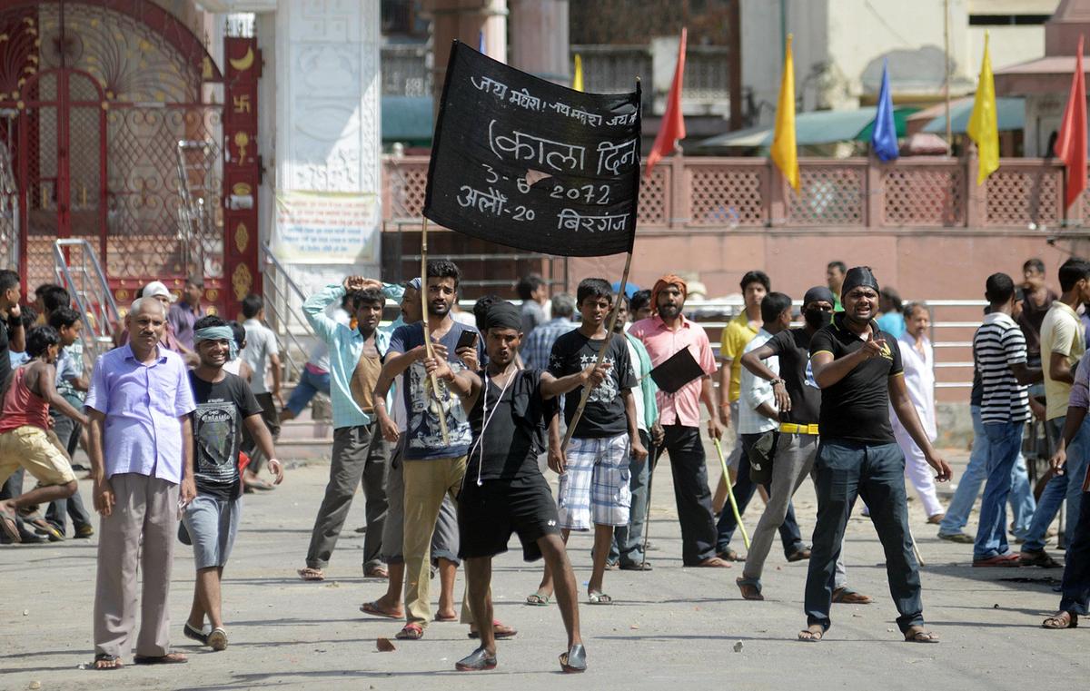 An ethnic Madhesi man holds a banner that reads “Hail Madhesh Hail Madhesi. Black Day,” during a protest against the country’s new constitution saying lawmakers ignored their concerns over how state borders should be defined, in Birgunj, Nepal, Sunday, Sept. 20, 2015. The new constitution replaced an interim one that was supposed to be in effect for only a couple of years but governed the nation since 2007. Police said clashes between officers and protesters on Sunday left one demonstrator dead near Birgunj town in southern Nepal. An ethnic Madhesi man holds a banner that reads “Hail Madhesh Hail Madhesi. Black Day,” during a protest against the country’s new constitution saying lawmakers ignored their concerns over how state borders should be defined, in Birgunj, Nepal, Sunday, Sept. 20, 2015. The new constitution replaced an interim one that was supposed to be in effect for only a couple of years but governed the nation since 2007. Police said clashes between officers and protesters on Sunday left one demonstrator dead near Birgunj town in southern Nepal.