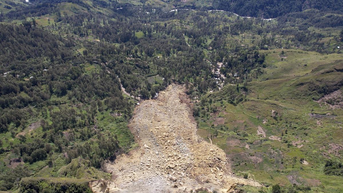 Papua New Guinea's prime minister visits the site of a landslide estimated to have killed hundreds