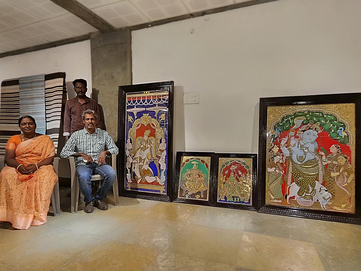 C Natarajan and Thalaikarasi showing Tanjore paintings.