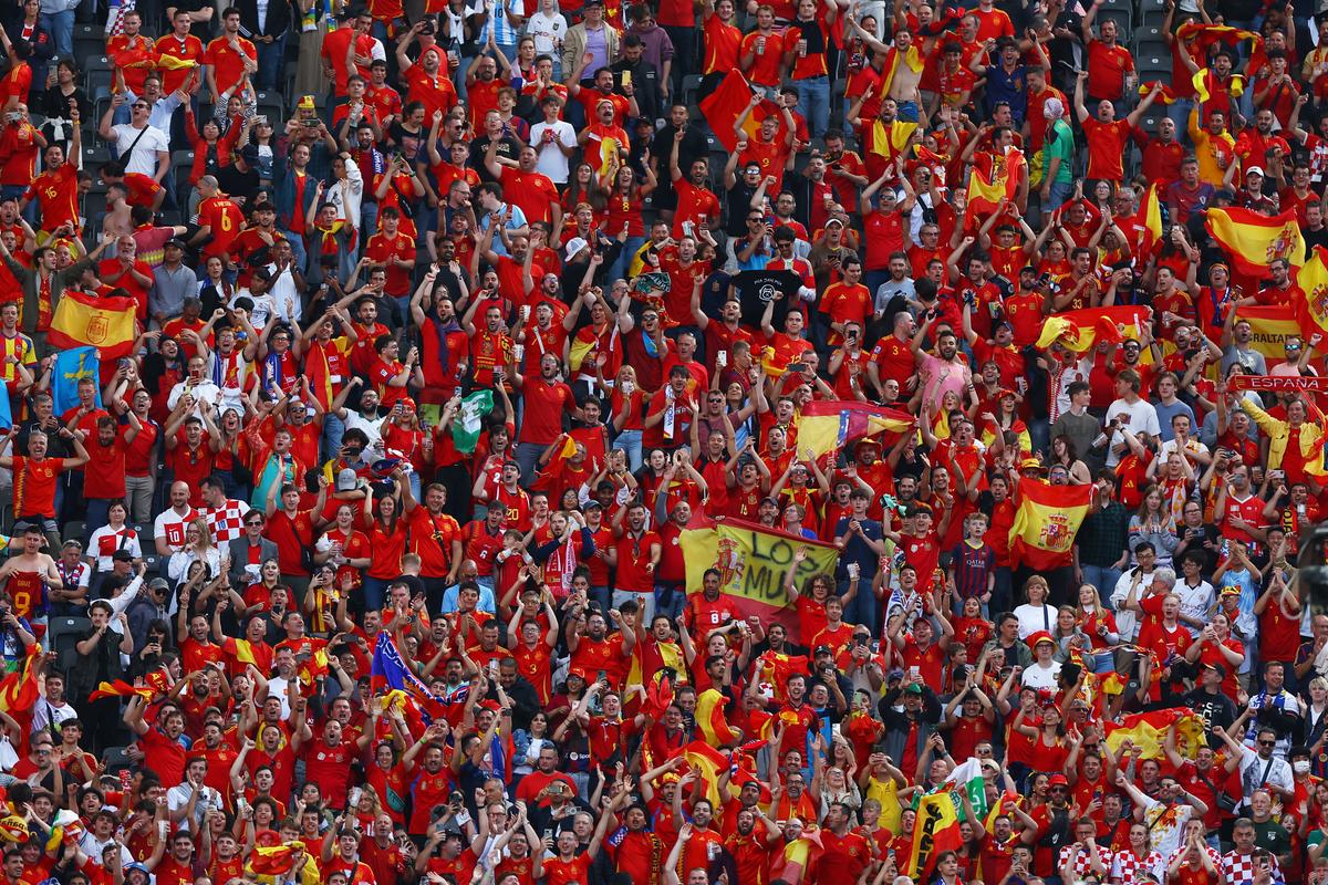 Spain fans celebrate their team’s win over Croatia.