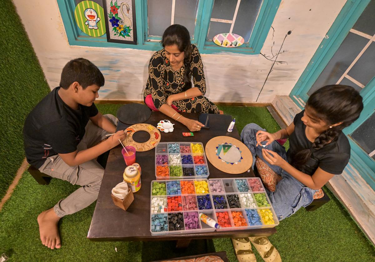 People engrossed in different art activity at Artgram, an initiative to promote various kinds of DIY art activities, at a cafe in Visakhapatnam. People engrossed in different art activity at Artgram, an initiative to promote various kinds of DIY art activities, at a cafe in Visakhapatnam.