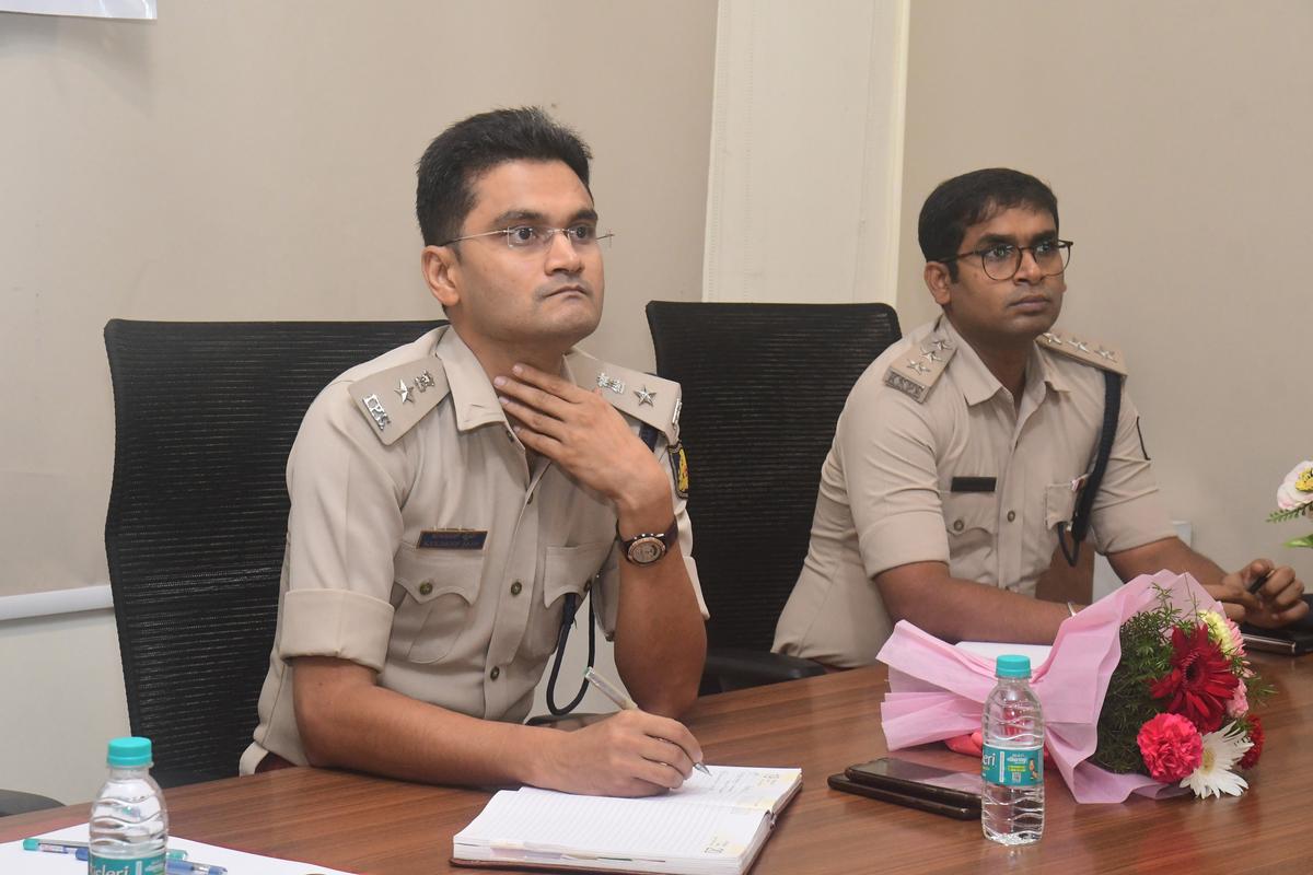   Commissioner of police Kuldeep Kumar R Jain (Left) along with Mahesh Kumar Naik, ACP North hold a meeting with the public as part of drug-free D.K campaign at Panambur police station,.