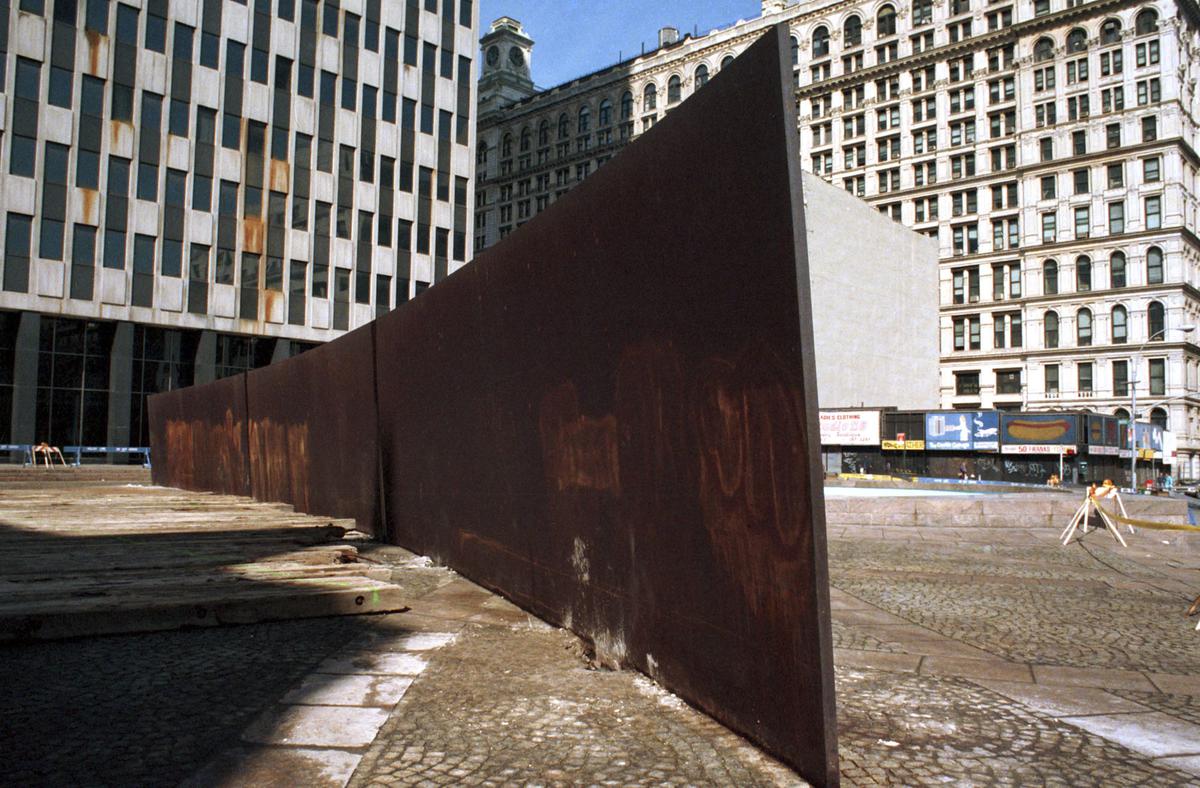 “Tilted Arc,” a 12-foot-high, curving, inclined wall of rusting steel by famed American sculptor Richard Serra, awaits removal, March 11, 1989, at Federal Plaza in the Manhattan borough of New York. 
