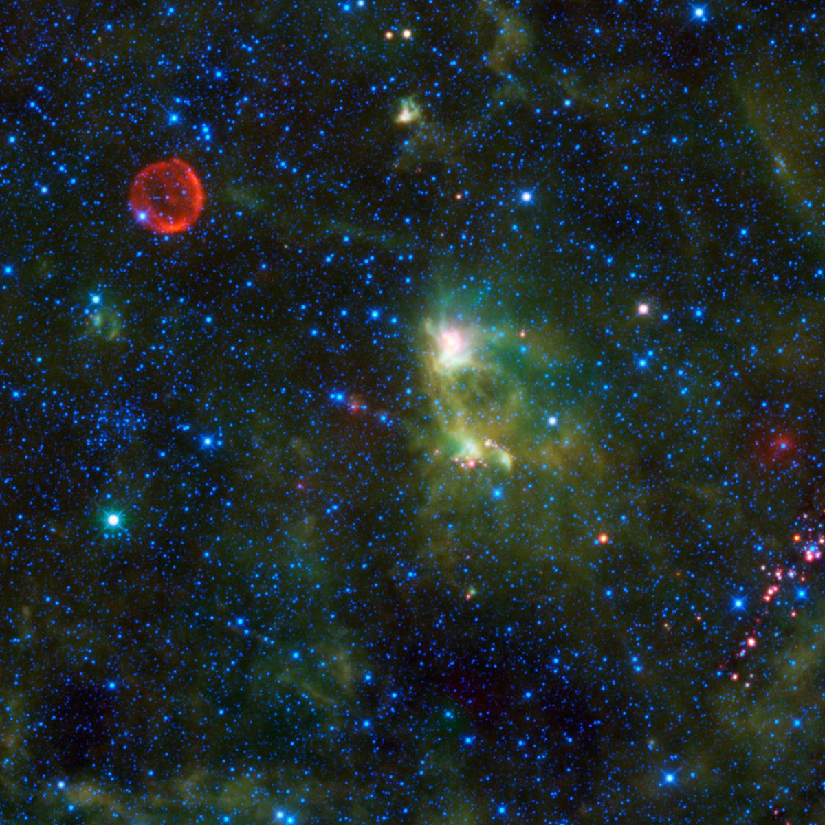 This image provided by the NASA/JPL-Caltech/WISE Team shows NASA’s Wide-field Infrared Survey Explorer (WISE) taking in several interesting objects in the constellation Cassiopeia. The red circle visible in the upper left part of the image is SN 1572, informally called “Tycho’s Supernova”. 