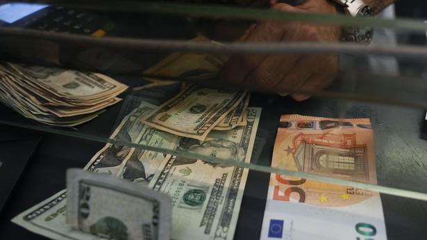Euro falls below dollar parity for first time since 2002