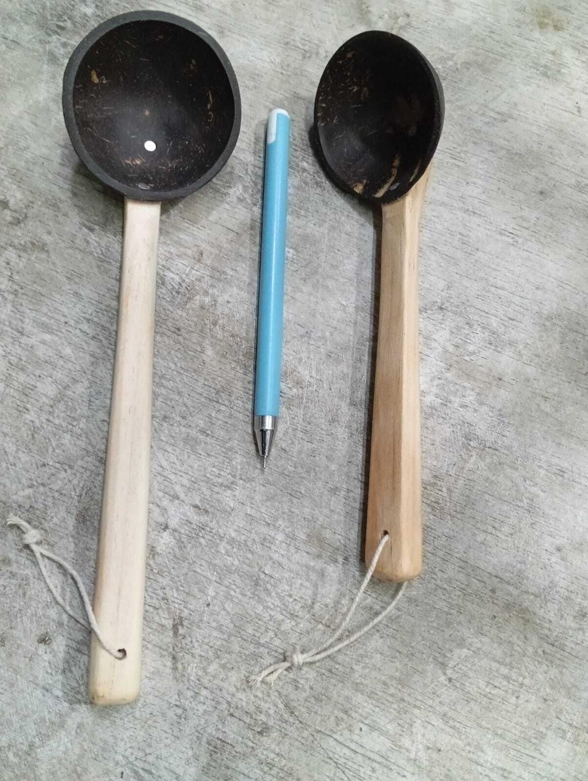 A ladle and a spoon shaped out of coconut shells and fitted out with wooden handles, at SN Crafts.