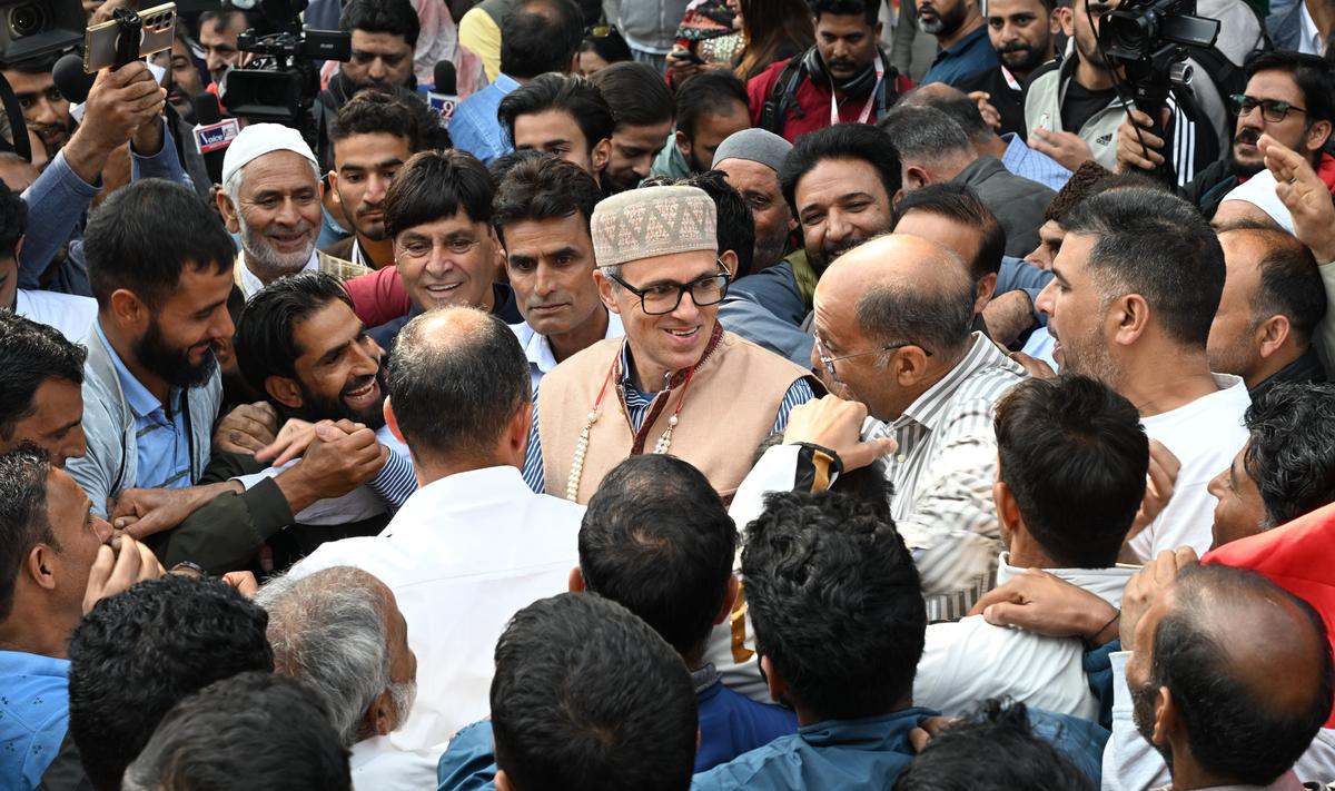 Jammu and Kashmir National Conference party Vice President Omar Abdullah greeted by supporters at his residence, a day after his victory at the J&K Assembly elections, in Srinagar on October 9, 2024. 