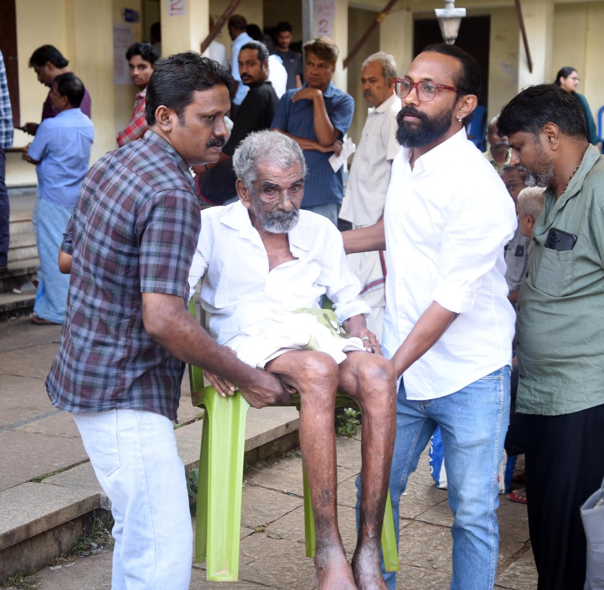 Eighty-year-old Krishnan being carried to the polling booth at Government Vocational Higher Secondary School for Girls, Nadakkavu, in Kozhikode to cast his vote on Thursday.