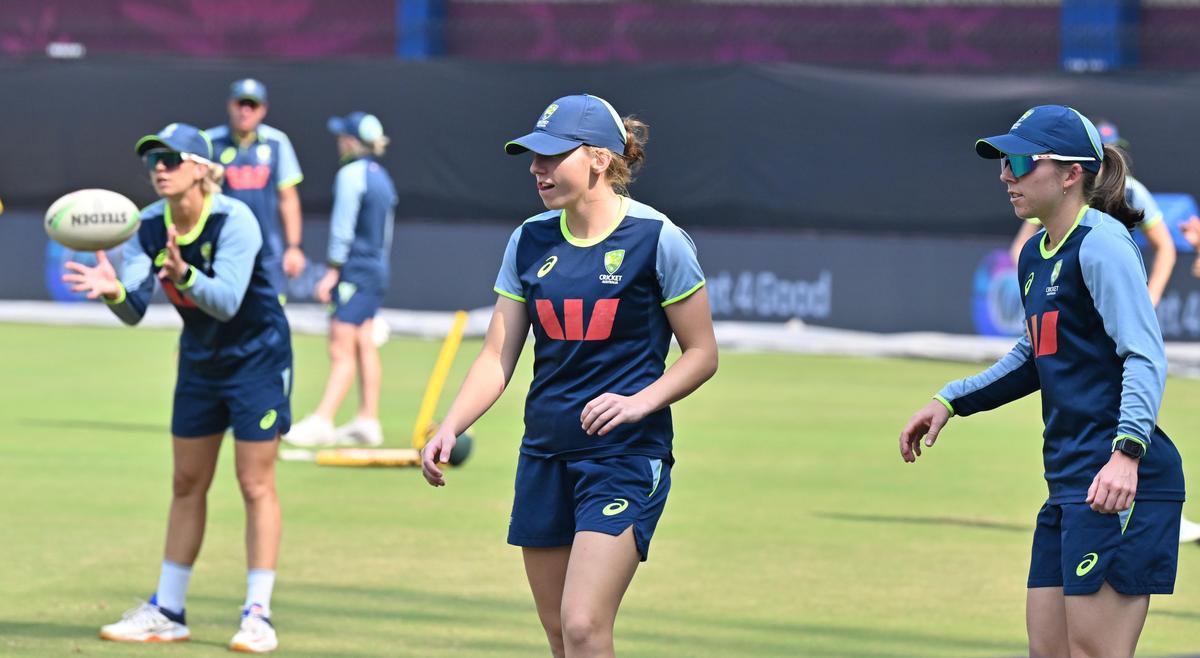 Australia’s Darcie Brown, centre, and Georgia Wareham, right during a training session ahead of their World Cup match against England at the Holkar Cricket Stadium in Indore, Madhya Pradesh on Tuesday, October 21, 2025.