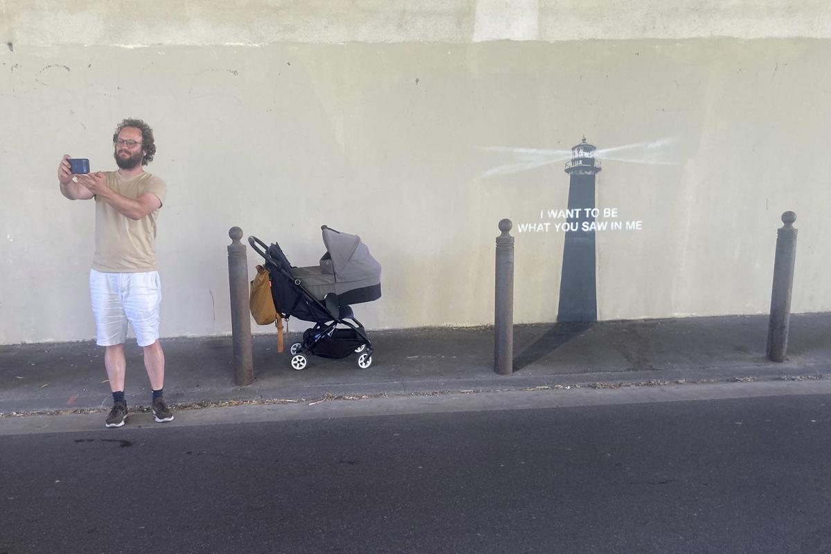 A man makes a selfie by an artwork by street artist Banksy on May 30, 2025 in Marseille, southern France. A man makes a selfie by an artwork by street artist Banksy on May 30, 2025 in Marseille, southern France.