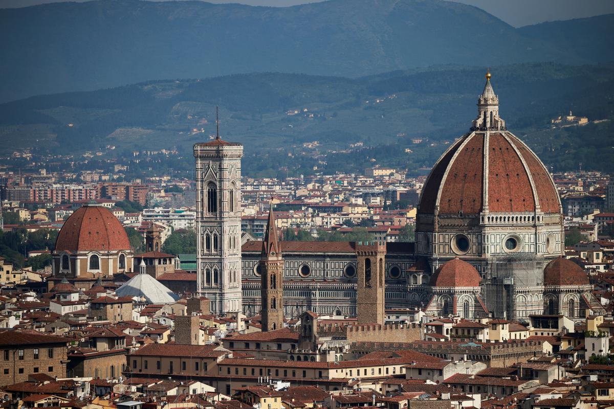 Brunelleschi’s Dome and Giotto’s Campanile of the Cathedral of Saint Mary of the Flower are pictured from a panoramic point of Florence, in Tuscany, Italy. File