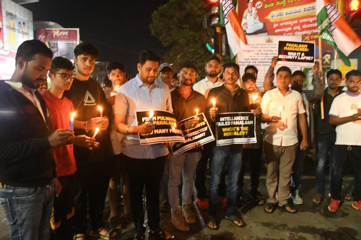 Condemning the terror attack in Pahalgam, members of Youth Congress staging a candle light vigil in Dharwad on Wednesday.