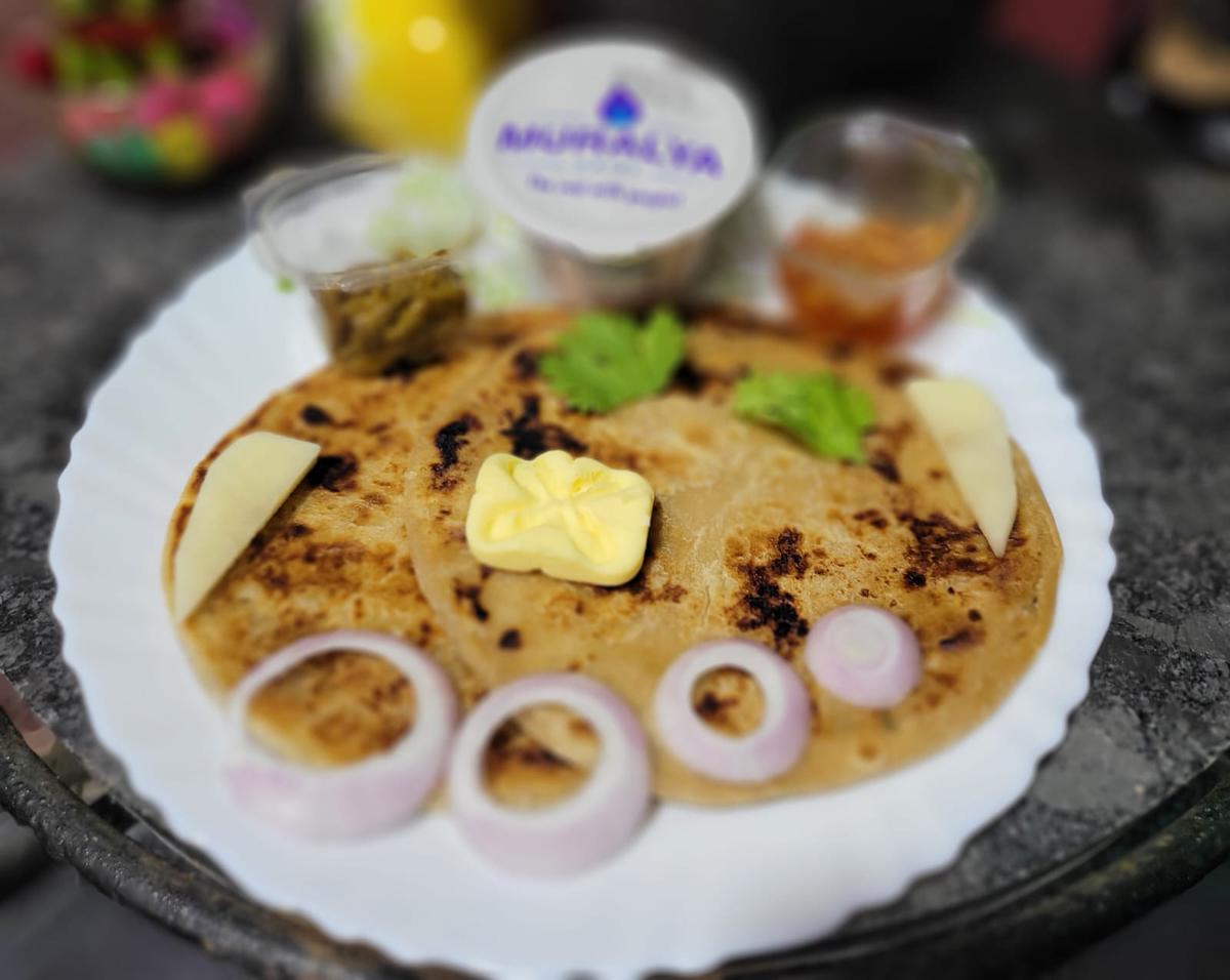 Aloo paratha from Vishnu Ka Dhaba served with butter, curd and pickles