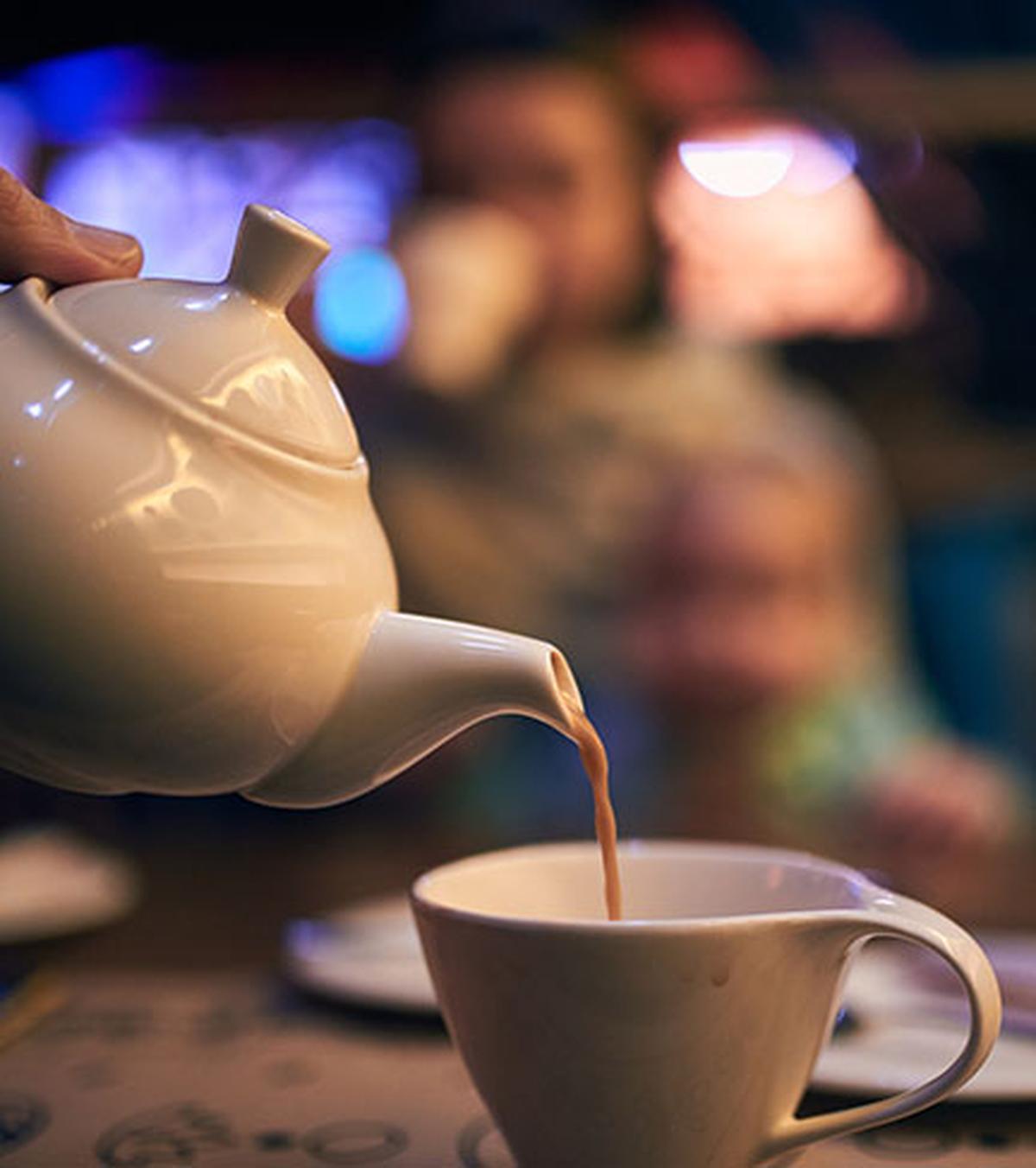 Pouring Masala milk tea into a cup. Pouring Masala milk tea into a cup.