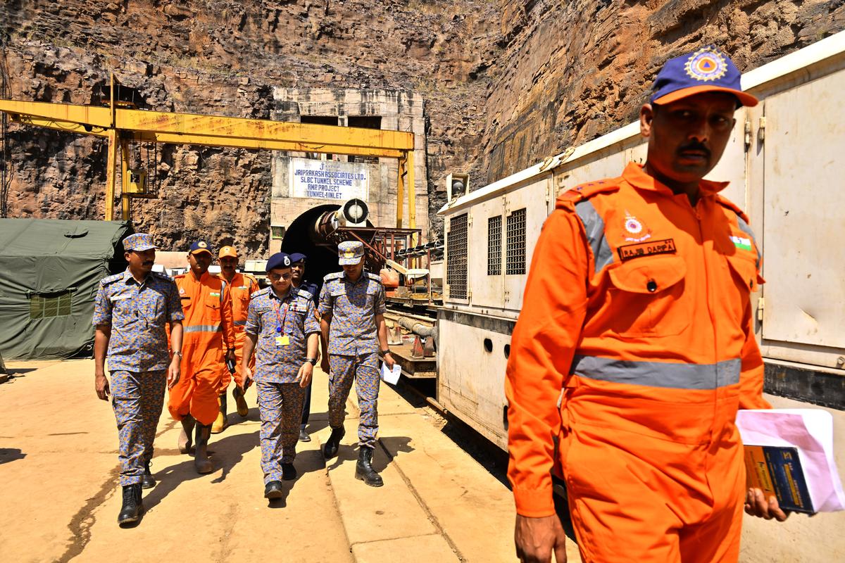 Members of the National Disaster Response Force prepare for a rescue operation at the SLBC tunnel. 