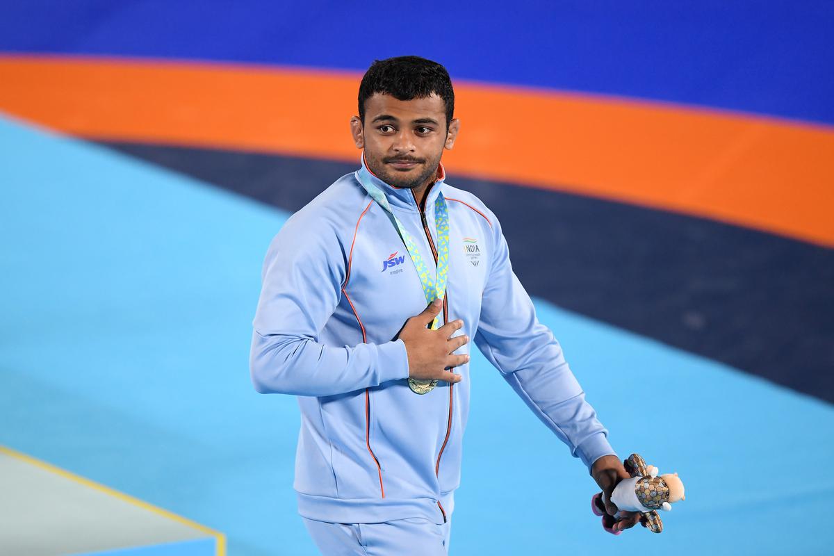 Gold medalist Deepak Punia of Team India celebrates during the Men’s Freestyle Wrestling 86 kg medal ceremony on day eight of the Birmingham 2022 Commonwealth Games at on August 05, 2022 on the Coventry, England.