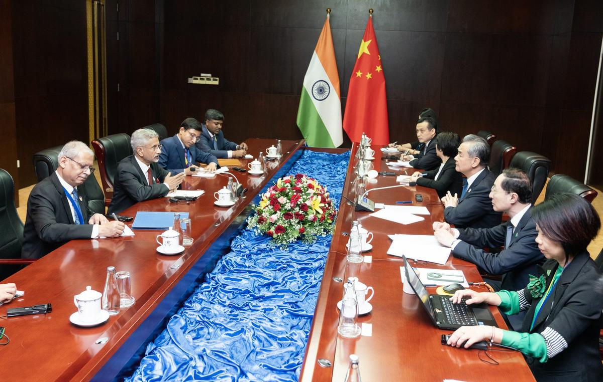 Minister of External Affairs S. Jaishankar with Foreign Minister of China Wang Yi during a meeting on the sidelines of ASEAN meetings, in Vientiane