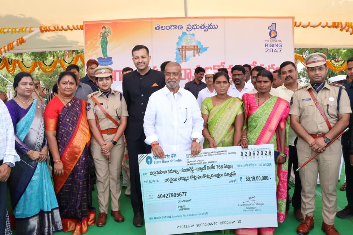 Telangana Health Minister C. Damodar Raja Narasimha handing over cheques worth ₹69.19 crore to 768 Self-Help Groups in Sangareddy on Tuesday, June 2.