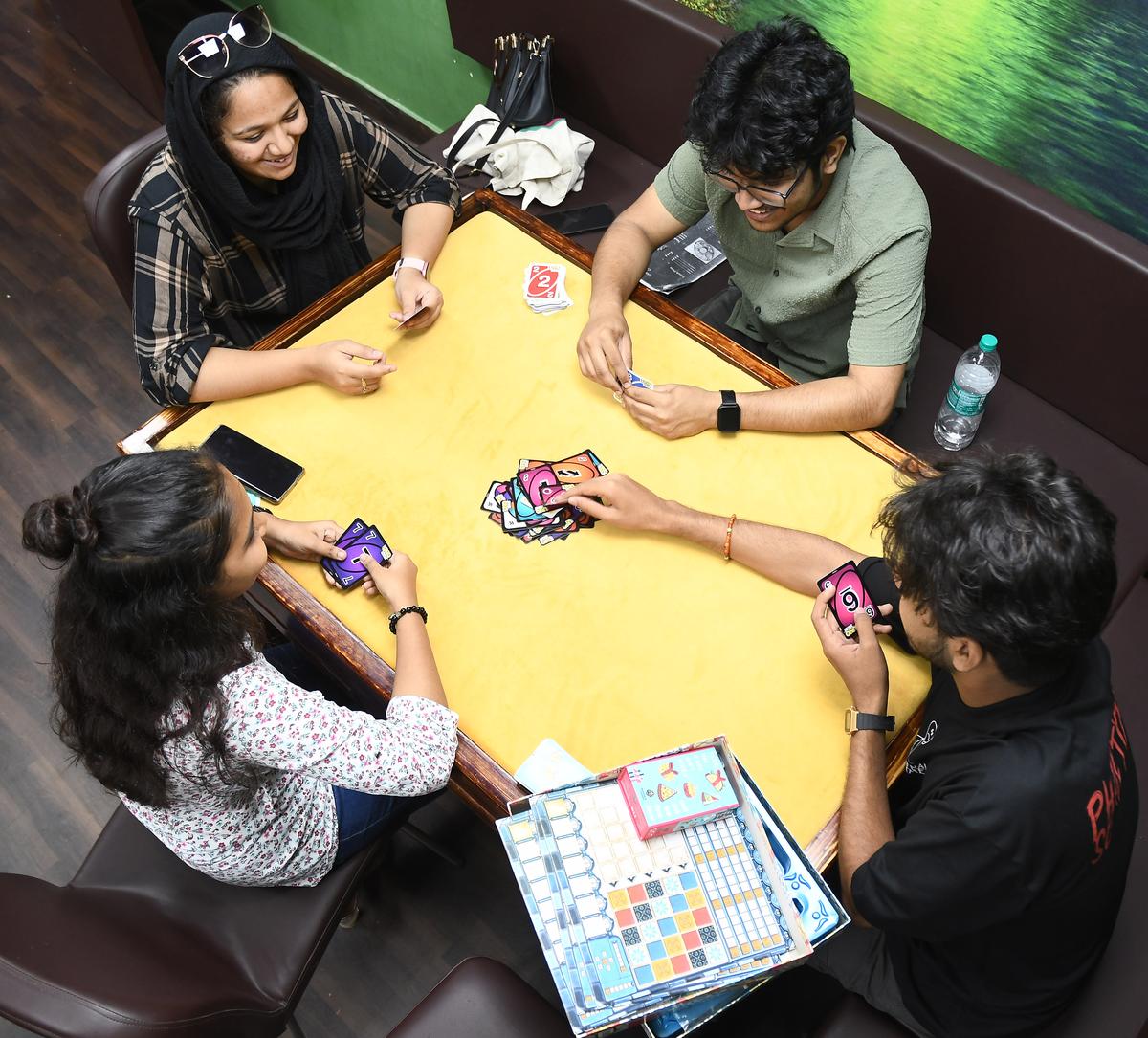 People playing board games