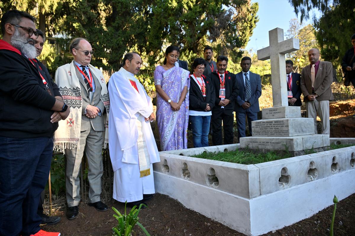Nilgiris district collector Lakshmi Bhavya Tanneeru and Mark Blackett-Ord, a descendant of James Wilkinson Breeks pay homage at Breeks cemetery at St Stephens Church in Ooty