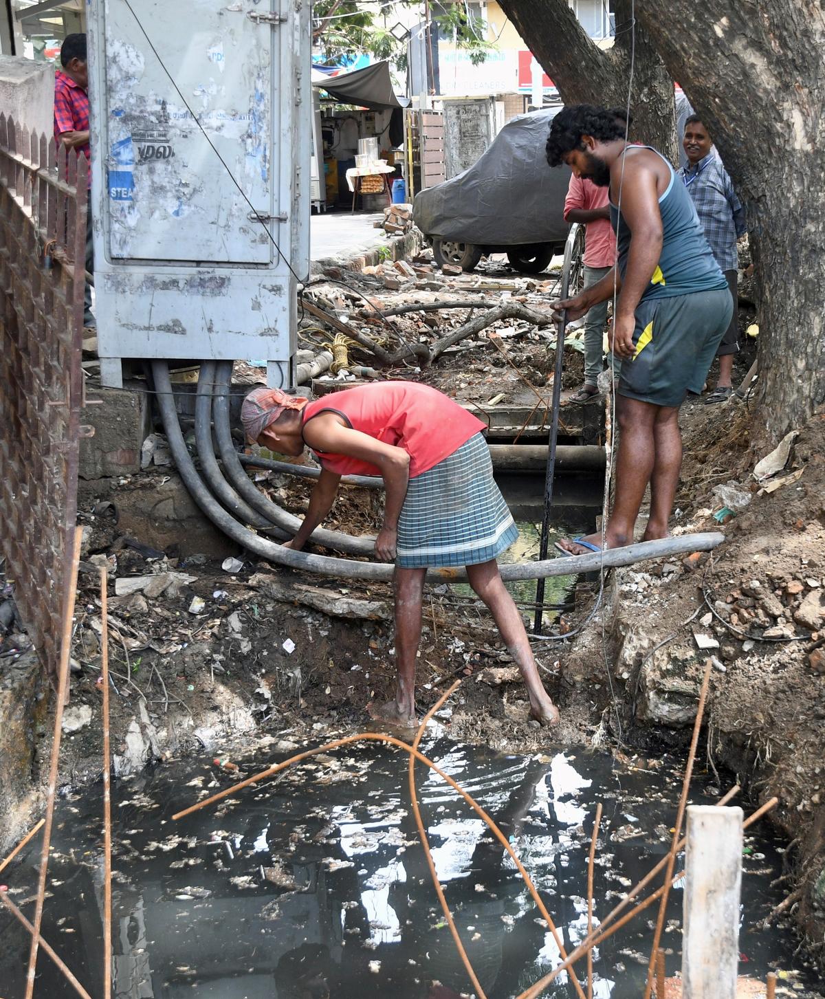 Underground power lines damaged, exposed during drain construction work The Hindu