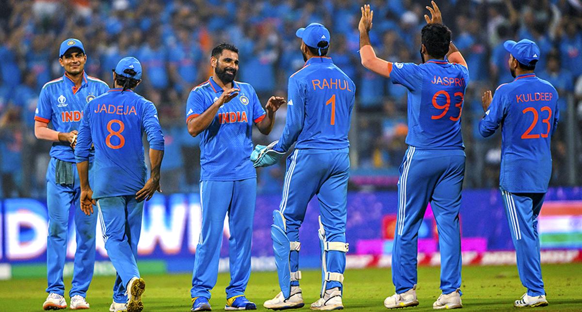 Mohammed Shami and Rohit Sharma celebrates after winning ICC Cricket World Cup 2023 Semi Final 1 between India and New Zealand at Wankhede Stadium in Mumbai on November 15, 2023