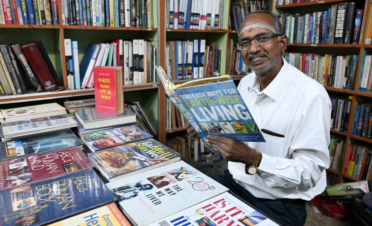 Book collector K. Balasubramaniyan with some special publications brought by Reader's Digest, in Tiruchi. 