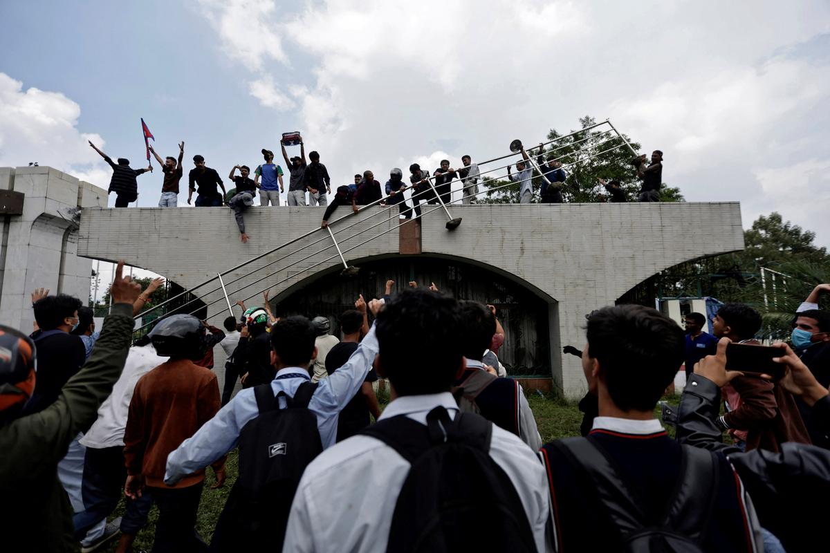 Demonstrators gather at the entrance of the Parliament during a protest against corruption and government’s decision to block several social media platforms, in Kathmandu, on September 8, 2025.