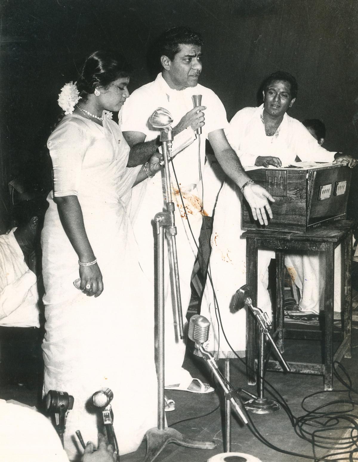 L.R. Eswari and actor Chandrababu with M.S. Viswanathan during a song recording. L.R. Eswari and actor Chandrababu with M.S. Viswanathan during a song recording.