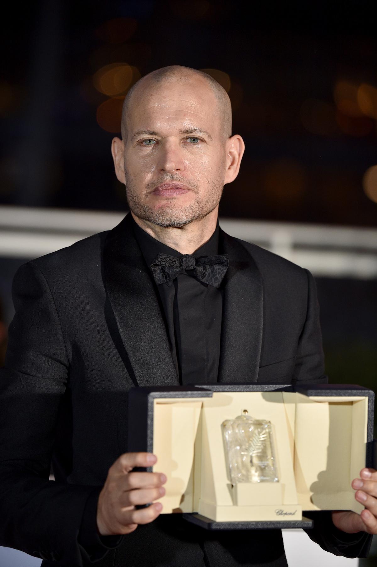 Nadav Lapid poses with the Jury Prize for ‘Ahed’s Knee’ at Cannes 2021.