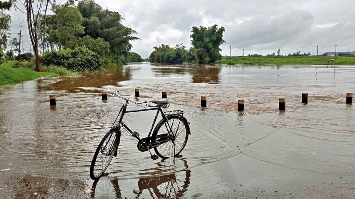 Video | Man bike washed away in flooded road in Belagavi