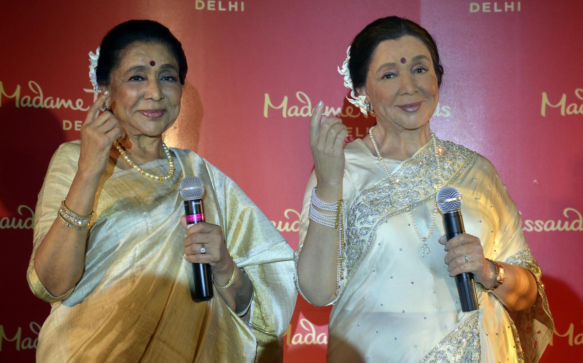 Asha Bhosle during the unveiling of her wax statue at Madame Tussauds New Delhi. 