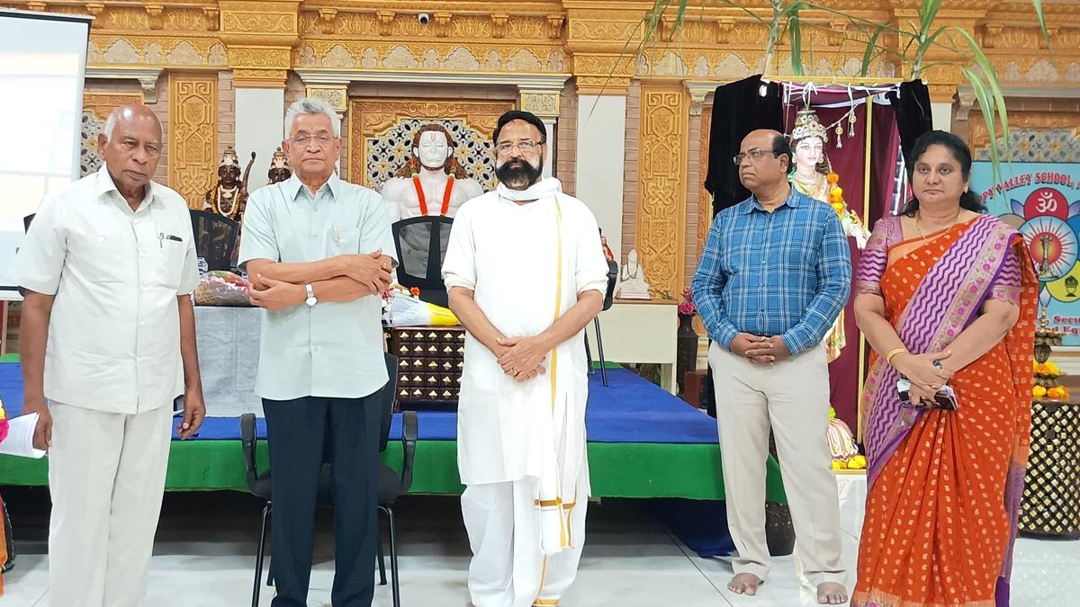 Entrepreneur interacts with schoolchildren