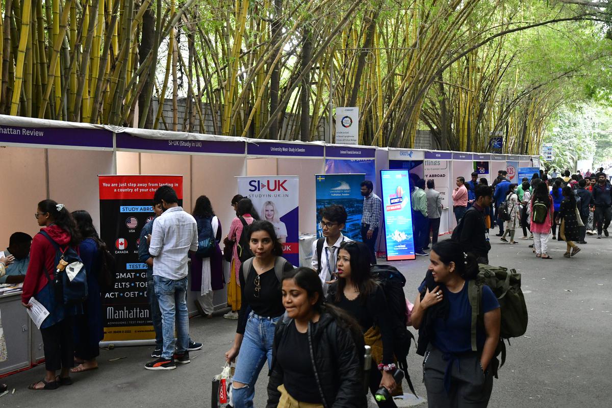Visitors at a stall set up during The Hindu International Education Fair Christ University in Bengaluru on Monday.