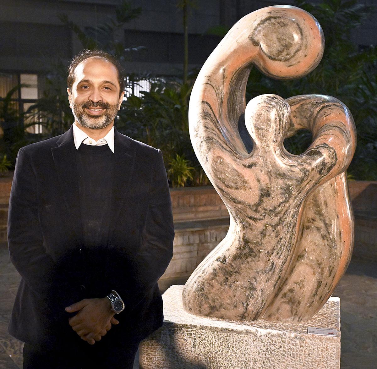 Narayan Lakshman with his sculpture titled Protected at the “The Forces of Imagination” exhibition in Delhi Photo: SHIV KUMAR PUSHPAKAR / The Hindu