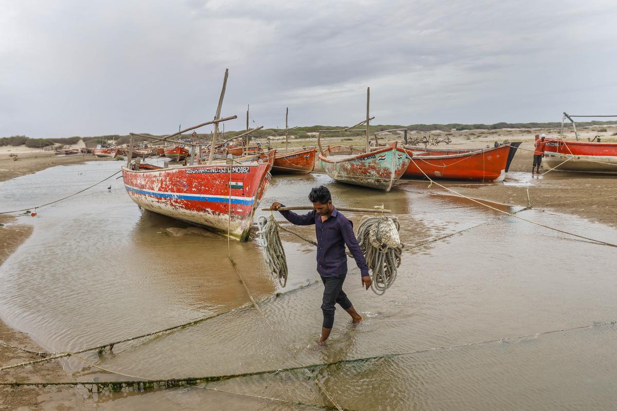 Fishermen anchor their boats at safe place ahead of the landfall of Biparjoy cyclone at Mandvi in Kutch district, on June 12, 2023. 