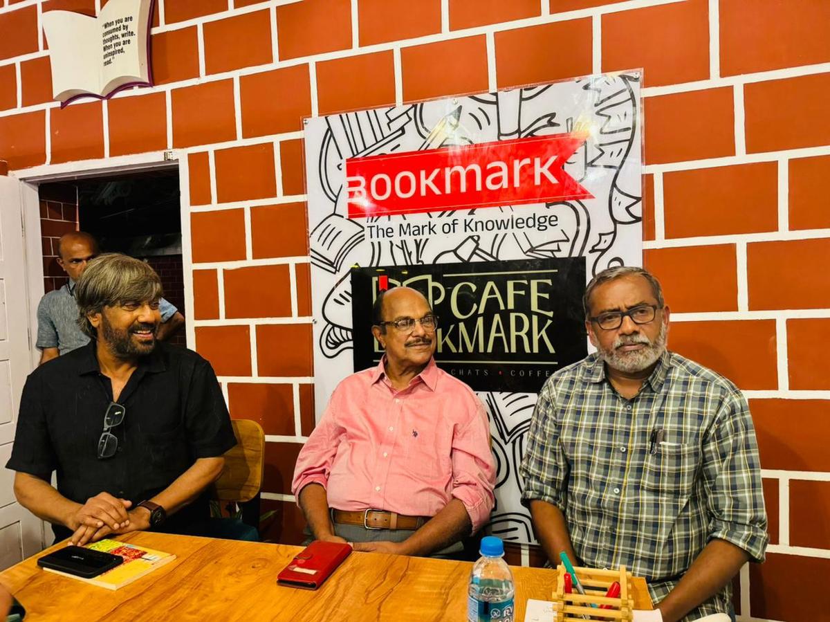 (From left) Abraham Mathew, academic KP Rajappan Nair and Agriculture Minister P Prasad  during a discussion at Cafe Book Mark. 