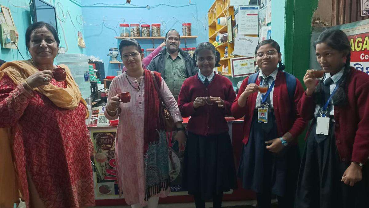 Jagannath Chinary (middle) with a few customers at his eatery