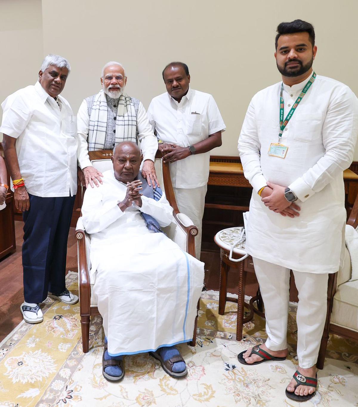 Former Prime Minister H. D. Deve Gowda with his son H.D. Revanna, Prime Minister Narendra Modi, former Karnataka Chief Minister H. D. Kumaraswamy, and grandson Prajwal Revanna. Former Prime Minister H. D. Deve Gowda with his son H.D. Revanna, Prime Minister Narendra Modi, former Karnataka Chief Minister H. D. Kumaraswamy, and grandson Prajwal Revanna.