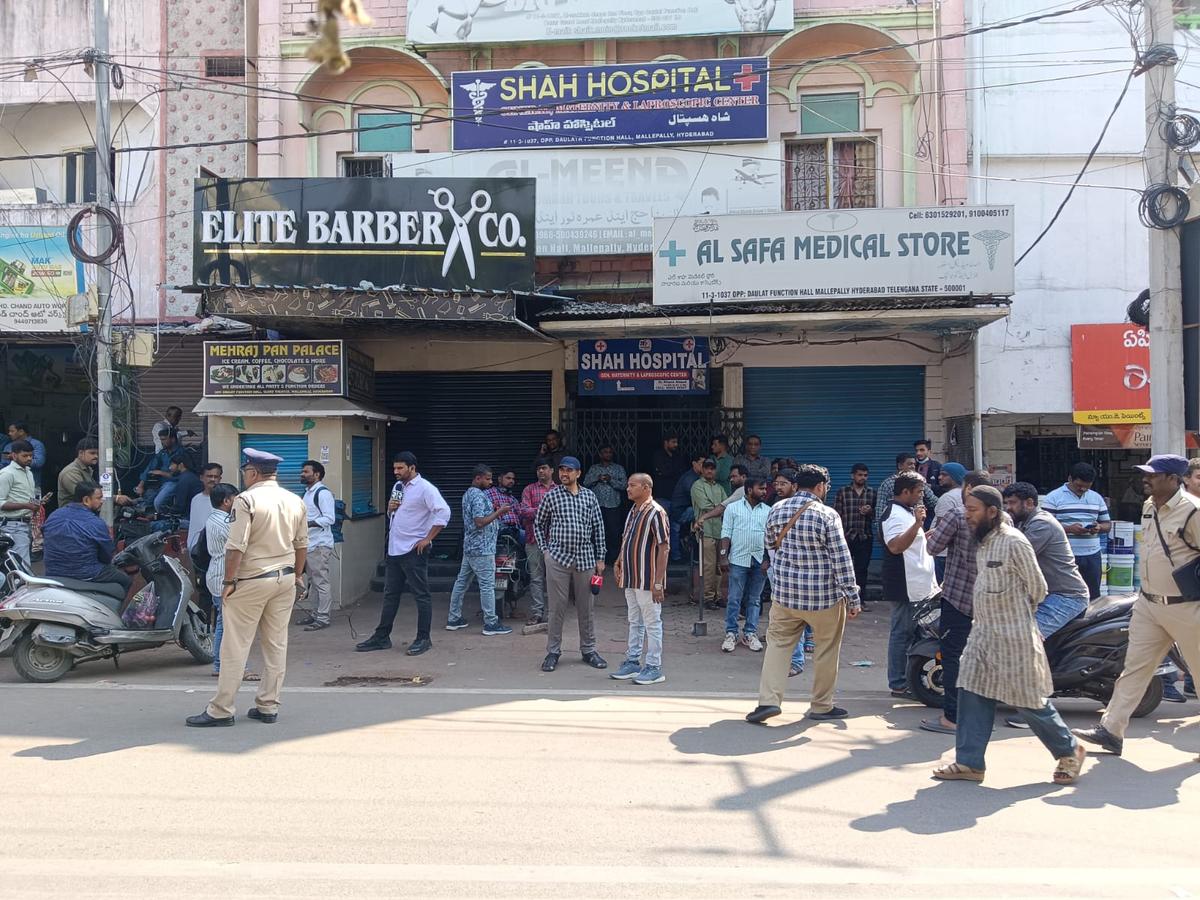 Anxious relatives of Umrah pilgrims gather outside Al-Meena Travels, one of the tour operators, in Hyderabad.