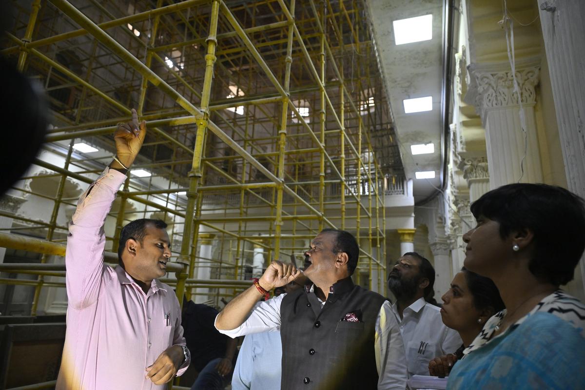 Telangana Roads and Buildings Minister Komatireddy Venkat Reddy inspects the works taken up to restore the 110-year-old heritage building in the Assembly premises in Hyderabad on Tuesday.