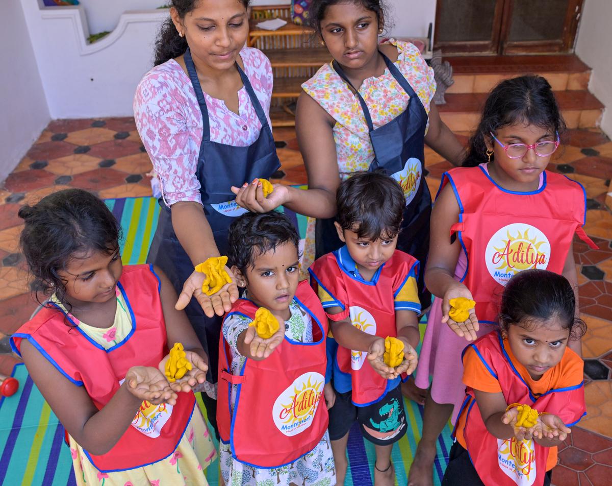 Children showing Ganesha idols made with gram flour and turmeric at a Montessori school in Visakhapatnam.