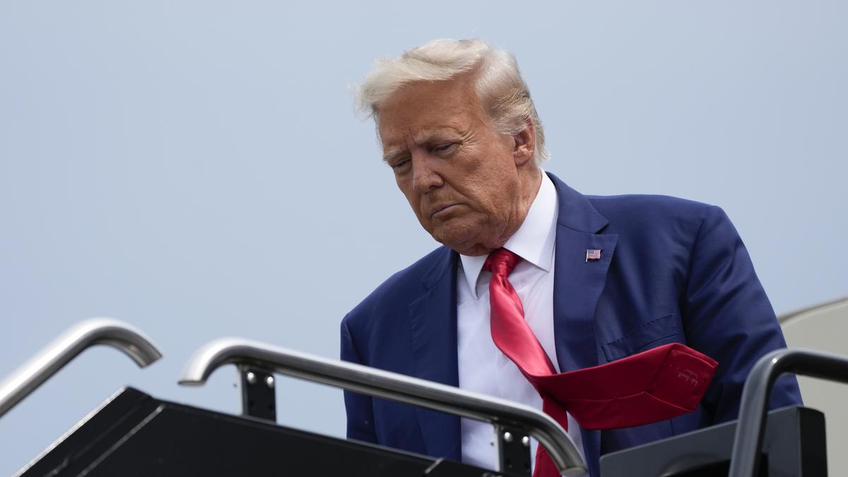 Former President Donald Trump arrives at Ronald Reagan Washington National Airport, Thursday, Aug. 3, 2023, in Arlington, as he heads to Washington to face a judge on federal conspiracy charges alleging Trump conspired to subvert the 2020 election. 