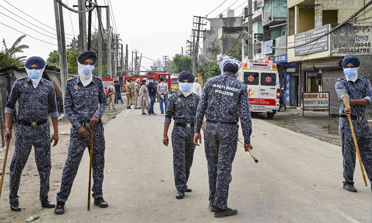 Security personnel at the site after a gas leak incident in the Giaspura area, in Ludhiana district on April 30, 2023. 