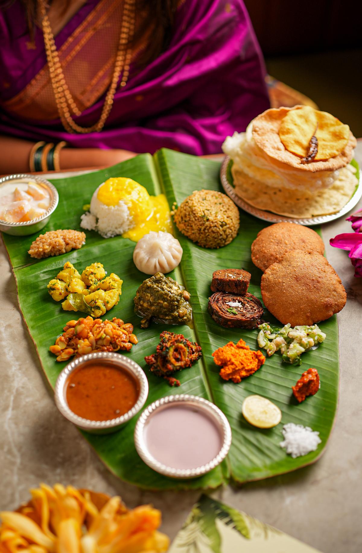 The thali includes chutneys, pickles, crispy aloo wadi and kothimbir wadi The thali includes chutneys, pickles, crispy aloo wadi and kothimbir wadi