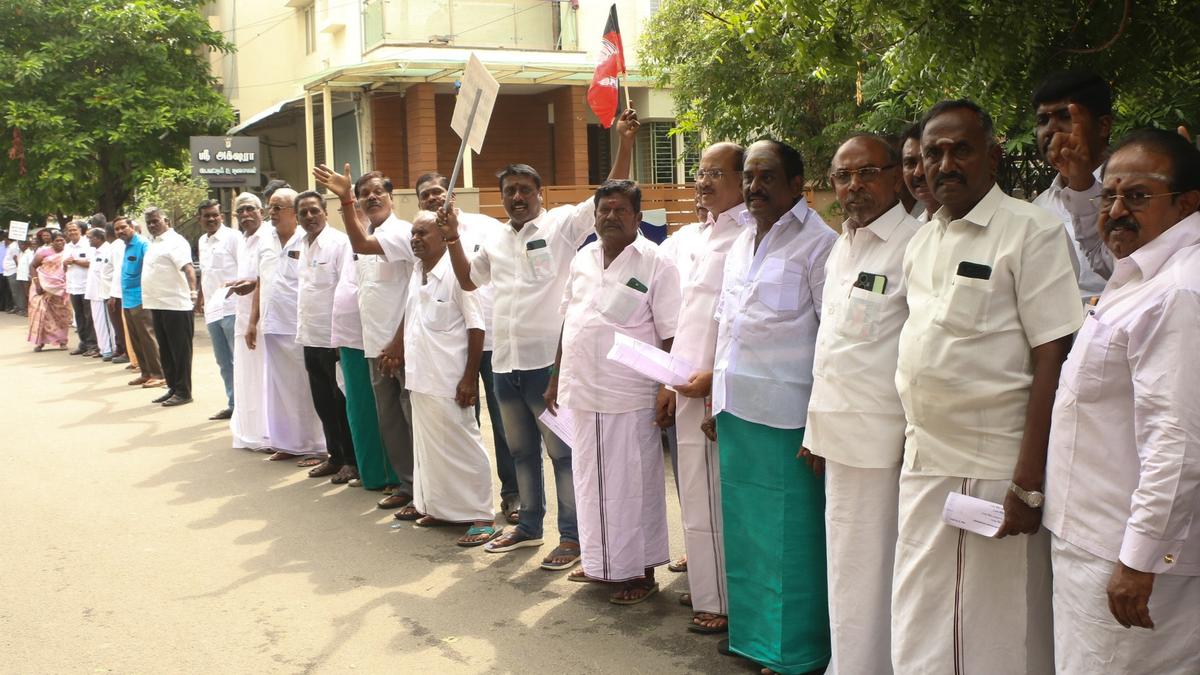 AIADMK cadre holds human chain protest against hike in property tax