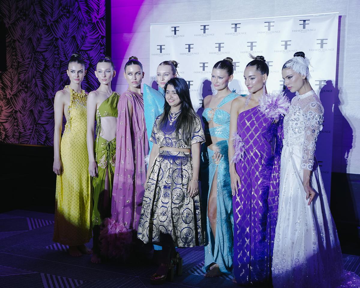 Deepika Khatri (centre) and a model wearing her creations