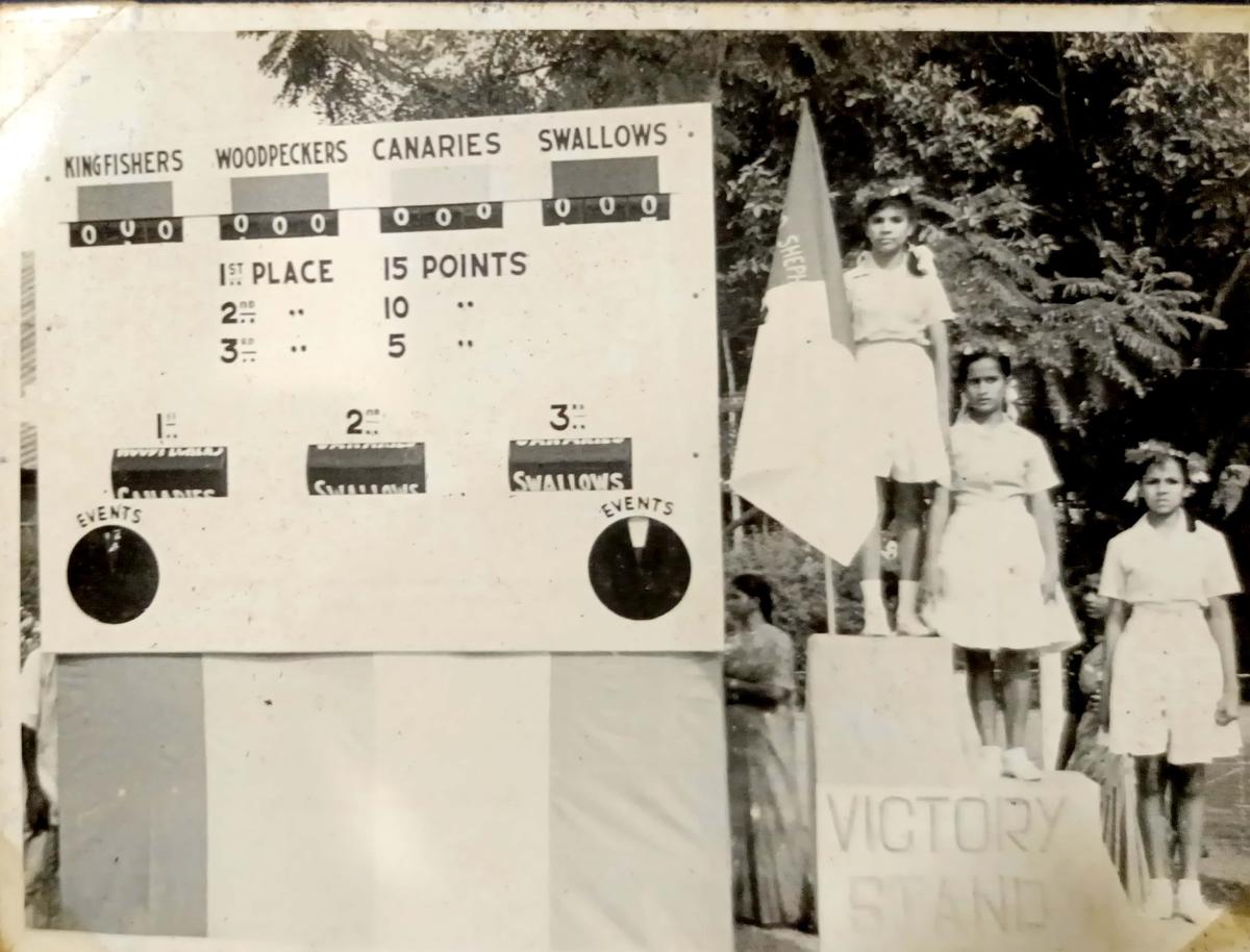 Students crowned with laurel wraths on the victory stand 